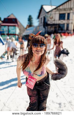 Sheregesh, Kemerovo region, Russia - April 16, 2016: Grelka Fest is a sports and entertainment activity for ski and snowboard riders in bikini.girl in pains holi.