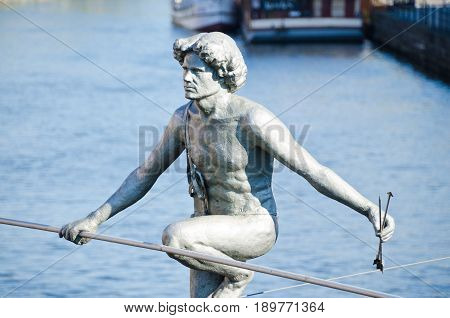 BYDGOSZCZ, POLAND. 8th APRIL 2017. The tightrope-walker sculpture over the River Brda is one of the many cultural attractions that are pulling tourists into the cit of Bydgoszcz in ever greater numbers.