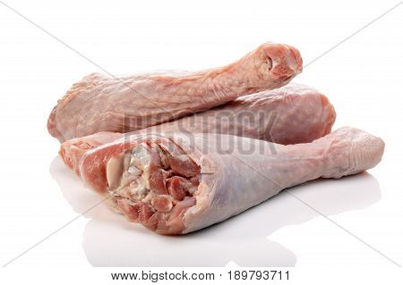 Raw turkey drumsticks or legs isolated on white