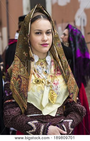 CAGLIARI, ITALY - MAY 1, 2017: 361 Religious procession of Sant'Efisio - portrait of a beautiful girl dressed in traditional Sardinian costume - Sardinia