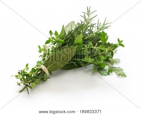 fresh bouquet garni, bunch of herbs isolated on white background