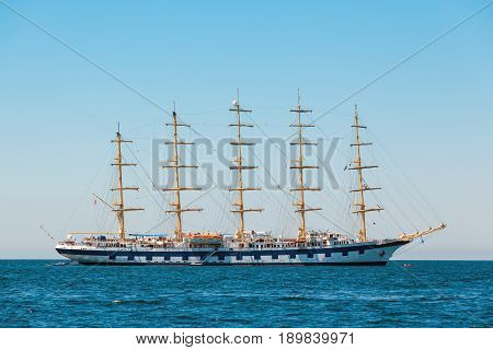 The world's largest sailing ship with five masts anchored in the open sea near old city Piran Slovenia.