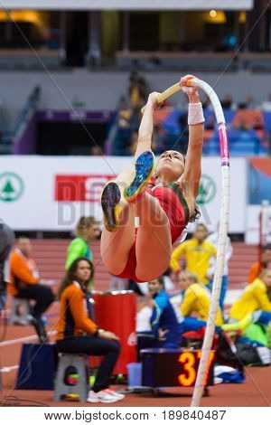 BELGRADE SERBIA - MARCH 3-5 2017: POLE VAULT WOMAN YAKALTSEVICH IRYNA EUROPEAN ATHLETICS INDOOR CHAMPIONSHIPS IN BELGRADE SERBIA