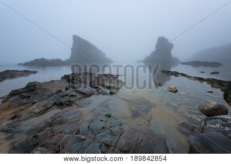 Magnificent seascape over the rock phenomenon The Ships, Sinemorets village, Bulgaria. Foggy weather.