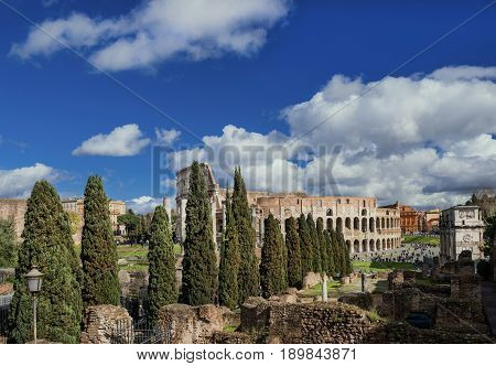 Coliseum ruins with Arch of Constantine seen from the Palatine Hill