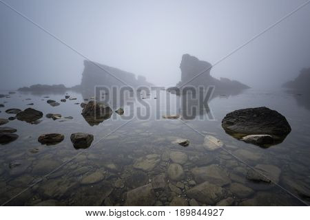 Magnificent seascape over the rock phenomenon The Ships, Sinemorets village, Bulgaria. Foggy weather.