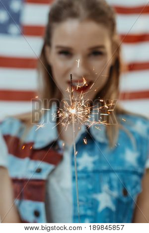 Hipster Girl In American Patriotic Outfit Holding Sparkler With Us Flag On Background, 4Th July - In