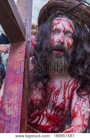 JERUSALEM - APRIL 14 : Christian pilgrim re-enact the crucifixtion of Jesus along the Via Dolorosa in Jerusalem during Good friday on April 14 2017