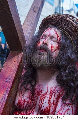 JERUSALEM - APRIL 14 : Christian pilgrim re-enact the crucifixtion of Jesus along the Via Dolorosa in Jerusalem during Good friday on April 14 2017