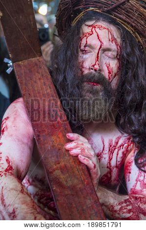 JERUSALEM - APRIL 14 : Christian pilgrim re-enact the crucifixtion of Jesus along the Via Dolorosa in Jerusalem during Good friday on April 14 2017