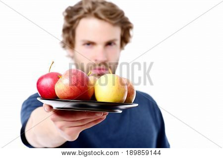 Face Expression Of Strong And Confident Man Offering Apples