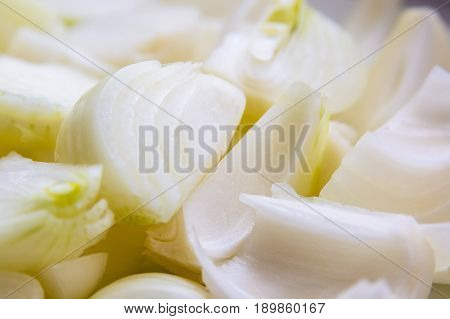 Close up pieces of chopped raw onion ready for cooking