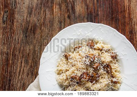Mushroom Risotto With Parmesan Cheese. Italian Food. Simple Back