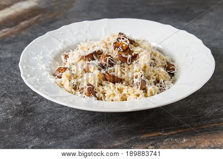 Mushroom Risotto With Parmesan Cheese. Italian Food. Simple Back