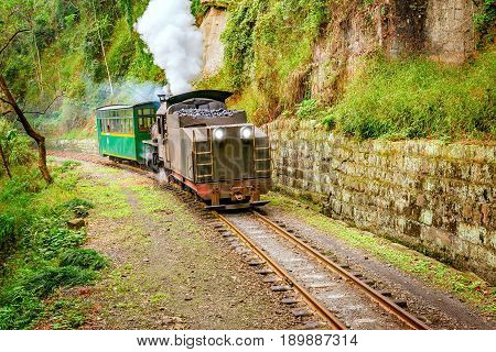 Steam narrow-gauge train moves from Bagou to Yuejin through the chinese countryside. Jiayang Mining Region. Sichuan province. China.