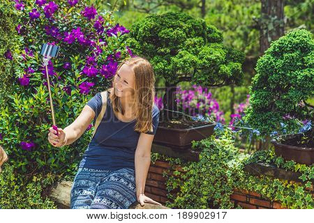 Young Beautiful Girl Doing Selfie Mobile Phone In The Park On Summer Day