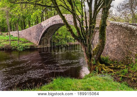 River Swale under Ivelet Bridge - The picturesque hump-backed bridge at Ivelet crosses the River Swale approximately a mile and half west of Gunnerside in Swaledale