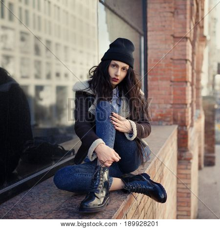Outdoor Lifestyle Portrait Of Pretty Young Girl, Wearing Hipster Swag Grunge Style On Urban Backgrou