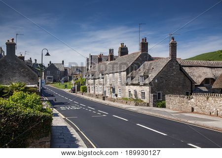 CORFE CASTLE, UK - 1st JUNE, 2017: Village of Corfe and ruins of Corfe Castle, in Swanage, Dorset, Southern England 