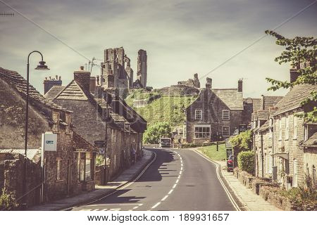 CORFE CASTLE, UK - 1st JUNE, 2017: Village of Corfe and ruins of Corfe Castle, in Swanage, Dorset, Southern England 