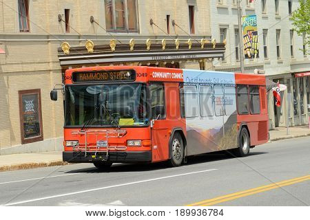 BANGOR, ME, USA - MAY 20, 2016: Hammond Street Route Community Bus on Main Street in downtown Bangor, Maine, USA.