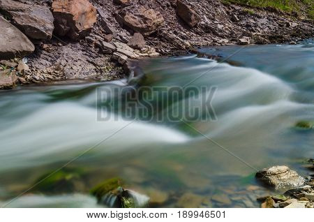 Background Of Carpathian Mountain River With Long Exposure