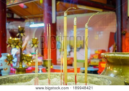 Burning incense inside a Buddhist temple in Kuala Lumpur, Malaysia
