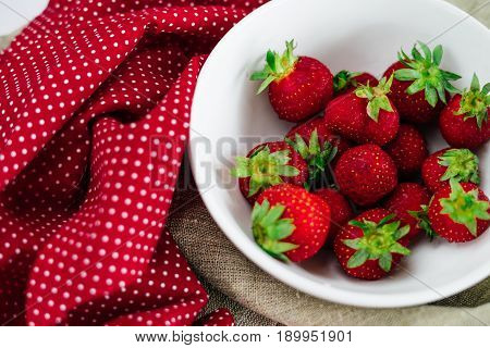 Fresh raw healthy diet strawberries fruit in plateisolated on whiteview aboveflatlay close-upcopyspace for textframe.Village rustic canvascountryside food