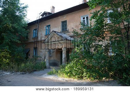 Old Soviet two-storied house with portico built by German prisoners after World War II in the late 40's and early 50's