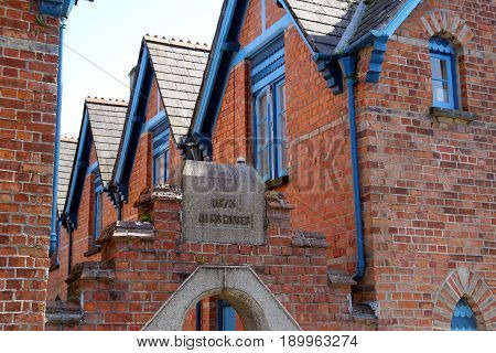 Padstow, Cornwall, Uk - April 6Th 2017: Victorian Red Brick Alms Houses, Dated 1875, Built By Rich B