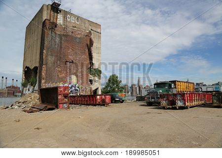 BROOKLYN, NEW YORK - JUNE 4, 2017: Abandoned building and view of Manhattan Midtown from Greenpoint, Brooklyn. Greenpoint is the northernmost neighborhood in the New York City borough of Brooklyn