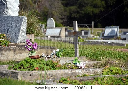 Narooma Australia - Apr 15 2017. Narooma graveyard is an amazing artistic cemetery with very individual graves with to the sea and Glasshouse Rocks beach.
