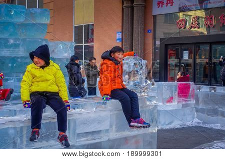 Harbin, China - February 9, 2017: Unknown tourists visiting the ice sculptures in Zhongyang pedestrian street, central street is a commercial long corridor of European architectural art