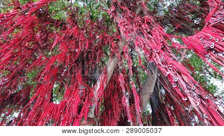 Sekinchan, Malaysia - 09 Mar, 2019: Wishing Words Written On Red Cloth With Steel Washers Hung Onto 