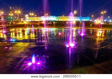 Colorful Water Fountain At Souq Waqif Park At Doha Corniche Illuminated At Night. Famous Tourist Att