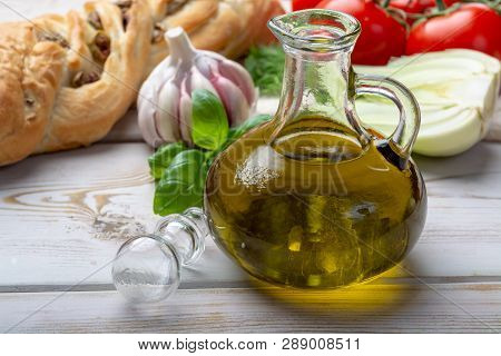 Virgin Natural Olive Oil Is Glass Bottle, Served With Traditional Mediterranean Food