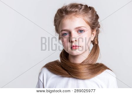 Appealing Good-looking Young Girl Covering Herself With Long Hair