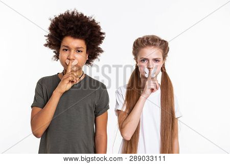 Serious Resolute Children Posing With Taped Mouths