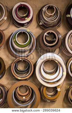 Plastic Pre Glued Edge Banding Tape For Furniture Decor And Repair. Object Is Hanging On A Wall In A