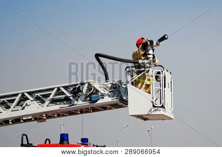 Ready To Work Lift The Fire Truck. Putting Out Fires And Saving People. Mechanisms And Devices