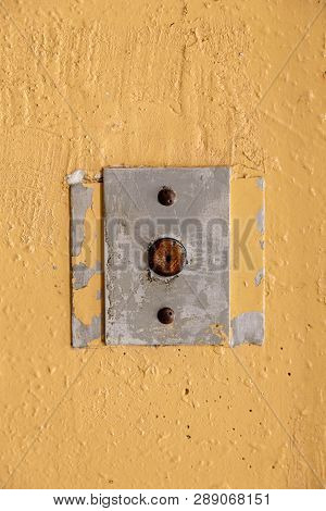 Old Elevator Call Button With Grungy Pattern In A Soviet Building In Post-soviet Riga, Latvia