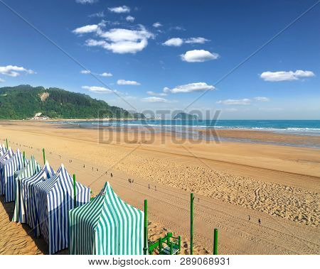View Of Zarauz City Beach With Yellow Sand And Blue Sea Water, Pais Vasco, Spain