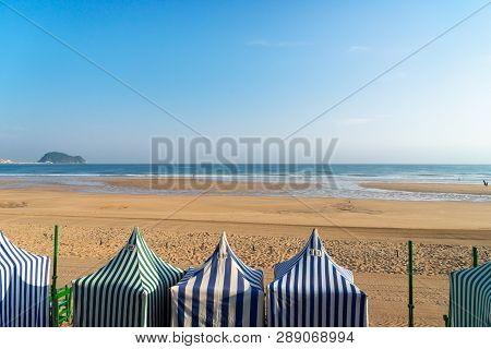 View Of Colorful Tents Of Zarauz Beach, Pais Vasco, Spain