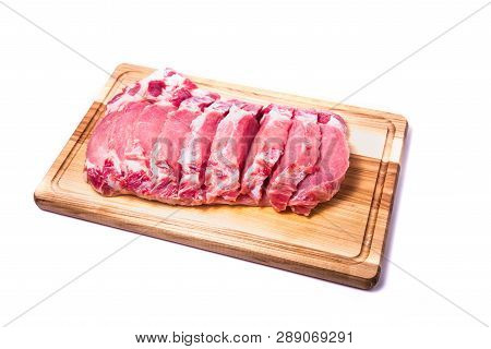 Raw Pork Meat On An Oak Wooden Board