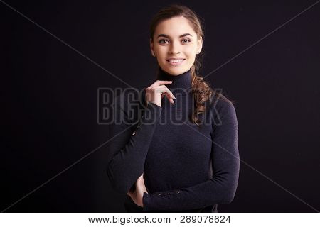 Beautiful Smiling Woman Posing At Isolated Black Background