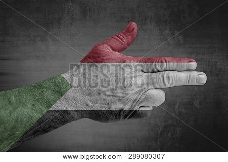 Sudan Flag Painted On Male Hand Like A Gun