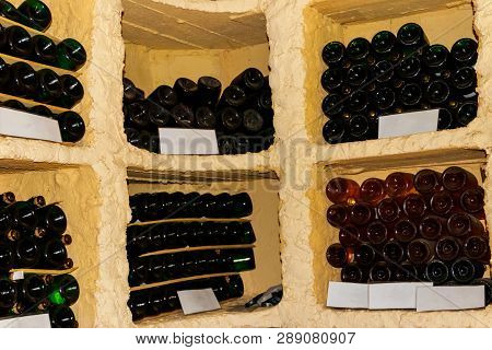 Many Champagne Bottles In A Wine Cellar