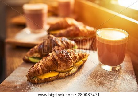 Fresh Croissant And Original Authors Coffee On Beet Milk With Fruits On Wooden Plate On Table. Healt