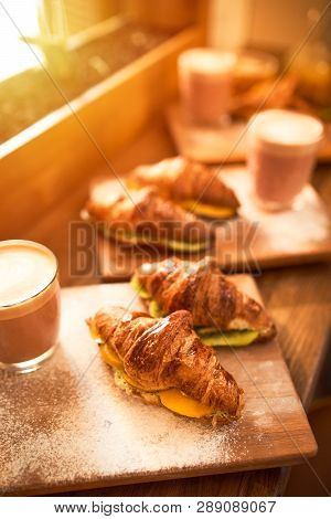 Fresh Croissant And Original Authors Coffee On Beet Milk With Fruits On Wooden Plate On Table. Healt