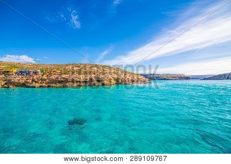 Comino, Malta - November, 2018: Tourists Crowd At Blue Lagoon To Enjoy The Clear Turquoise Water On
